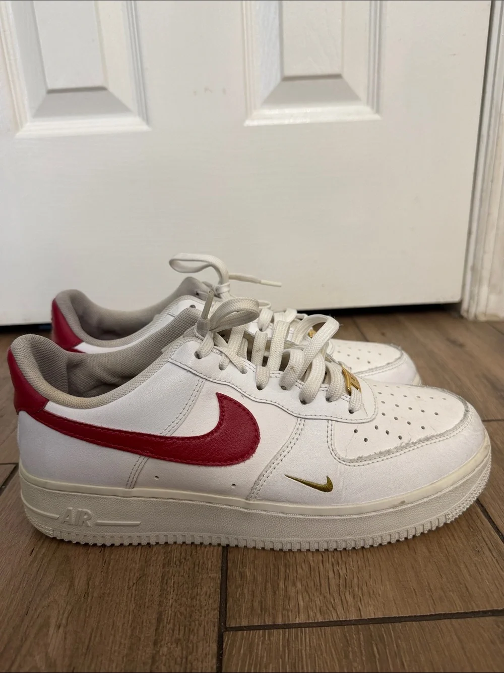 Nike Air Force 1 '07 ESS White Sneakers with Red Swoosh